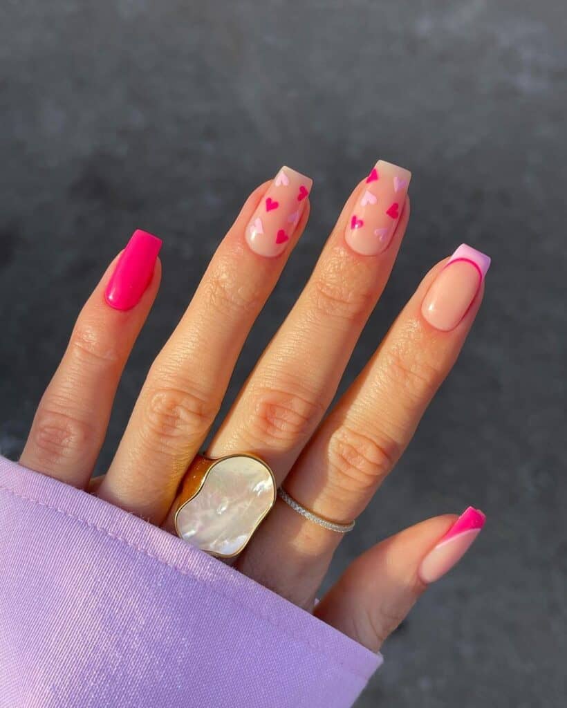 pink French tip nails with mix and match baby hearts