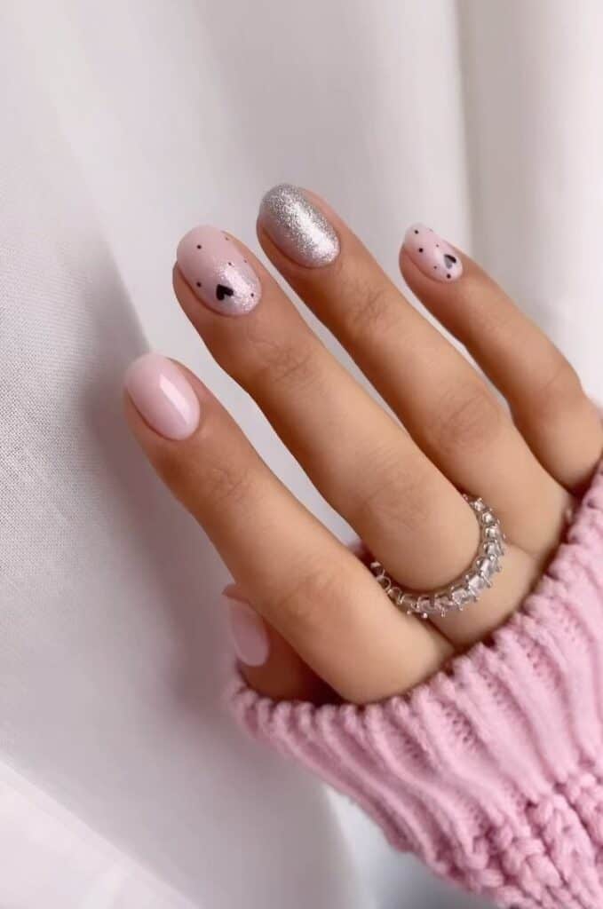 Cute Short Black Hearts Valentine’s Day Nails with a touch of silvery glittered fingertip nail 